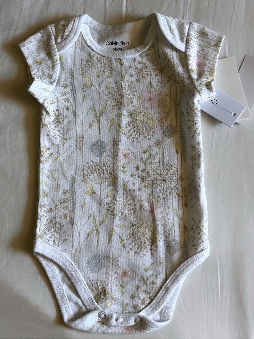 Calvin Klein White Floral Onesie with Pastel Pink & Green Accents